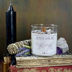 quantum jump spell candle hand poured, small-batch 8-ounce spell candle! Scented with lime and lavender essential oils &amp; topped with clear quartz, watermelon tourmaline, and amethyst. Spell Candle, Hedge Witch, Candle Spells, Watermelon Tourmaline, Book Stationery, Lavender Essential Oil, Small Batch, Clear Quartz, Hand Poured