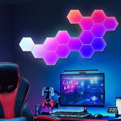 a gaming chair sitting in front of a desk with a computer on top of it