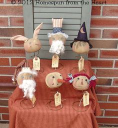 a table topped with pumpkins and stuffed animals