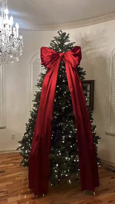 a christmas tree with a red bow on it