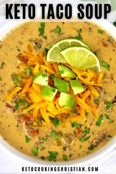 a white bowl filled with soup and topped with cheese, avocado and cilantro