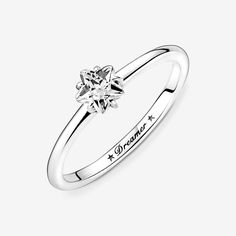 Bring starry sparkle to your outfits with the Celestial Sparkling Star Solitaire Ring. Inspired by celestial beauty, the sleek sterling silver ring features a center star-shaped clear cubic zirconia stone and is complemented by two asymmetric stars and the word "Dreamer" engraved inside the shank. The dazzling design looks equally stunning worn on its own or layered with contrasting Pandora rings in different metal tones. A classic and sophisticated addition to any collection. - Pandora Celestia Pandora Celestial, Pandora Star, Sparkling Stars, Pandora Rings, Jewelry Accessories Ideas, Jewelry Lookbook, Star Ring, Girly Jewelry, Pandora Bracelet