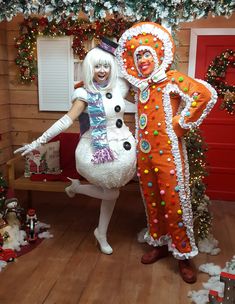 two people dressed in costumes standing next to each other