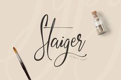 the word stager written in cursive writing next to an artist's brush