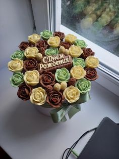 there is a cake decorated with flowers on the table