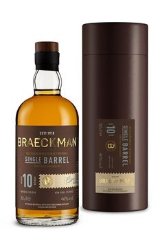 a bottle of brack man single barrel whiskey next to a canister on a white background