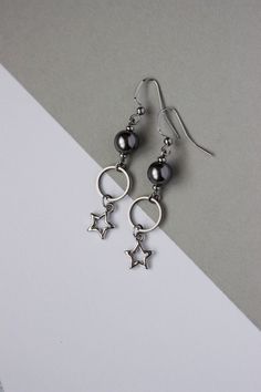 Unique earrings with dark gray finest quality European crystal pearl coated 8 mm beads, stainless steel rings, silver tone star charms,  tiny steel beads-separators and high quality stainless steel earring hooks. Earrings are from nickel free and lead free metal. Perfect for everyday wear and a great gift for someone special! *The total lenght of earrings is about 60 mm from top to the end. Other earrings of my shop you can see here: https://www.etsy.com/shop/NaTavelli?section_id=13757927 Thanks Stainless Steel Drop Earrings, Star Dangle Earrings, Grey Pearl Earrings, Wire Wrap Jewelry Designs, Earrings Star, Gray Earrings, Earrings Trendy, Rings Silver, Steel Earrings