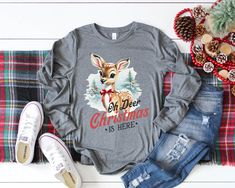 Oh Deer Christmas is here shirt Welcome to Shop Tee Shirts 4 U! HOW TO ORDER 1. Choose the Shirt Style and Size from the drop-down menu. All shirt styles, colors, fabric content, and measurements are in the pictures. Since all shirts are made to order I do not accept returns or exchanges. If there is a problem with your shirt please message me.  Thanks for stopping by:) Stephanie Vintage Christmas Shirt, Deer Christmas, Oh Deer, Family Shirt, Christmas Deer, Shirt Styles, Shirt Long Sleeve, Christmas Is, Matching Shirts