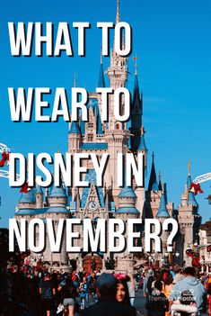 people walking in front of a castle with the words what to wear to disney in november?