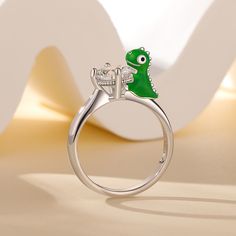 Daspletosaurus, also known as Tyrannosaurus, is a genus of dinosaurs under the family Tyrannosaurus that lived in western North America during the Upper Cretaceous period, 77 million to 74 million years ago. This Jeulia Hug Me® ring is made of sterling silver, vividly presenting the cute posture of a cartoon daspletosaurus. It will be perfect gift for dinosaur lovers or just add an special addition to your jewel collection. You will find more adorable and creative designs in our Hug Me® collecti Me Cartoon, Dinosaur Jewelry, Cretaceous Period, Cartoon Dinosaur, Hug Me, Buy One Get One, A Cartoon, Creative Designs, Quality Jewelry