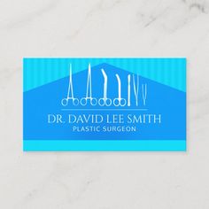 a blue business card with dental instruments on the front and bottom corner, which reads dr david lee smith plastic surgeon