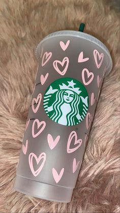 the starbucks cup has hearts on it