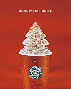 a starbucks drink with whipped cream on top and the words holiday drinks are here above it