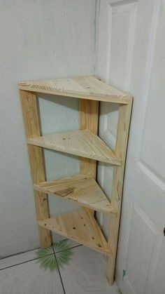 a wooden shelf sitting in the corner of a room