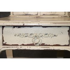 an old white dresser with the word love written on it's drawer and two drawers