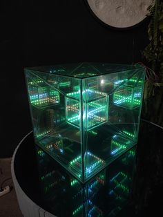 an illuminated display case sitting on top of a table