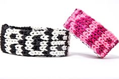 two crocheted bracelets sitting next to each other