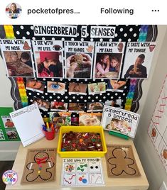 a table topped with pictures and magnets next to a bulletin board covered in gingerbread