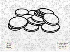 a pile of cookies sitting on top of a white tablecloth covered in black ink