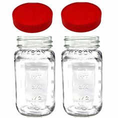 two empty mason jars with red lids