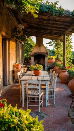 an outdoor dining area with potted plants on the patio