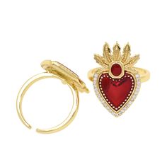 a gold ring with a red heart on top and a diamond crown on the bottom