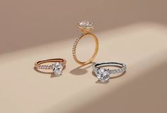 three different types of engagement rings with diamonds on them, one in gold and the other in silver