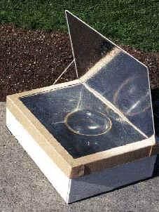 an upside down glass box sitting on the ground