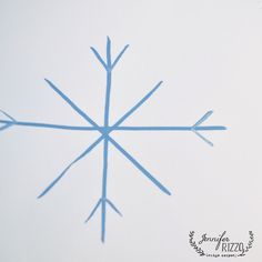 a snowflake is shown in the sky on a white background with blue lines