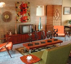 a living room filled with furniture and a flat screen tv sitting on top of a wooden table