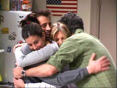 three people hugging each other in front of an american flag on the refrigerator freezer