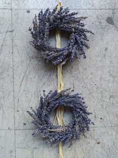 two dried lavender wreaths on the ground