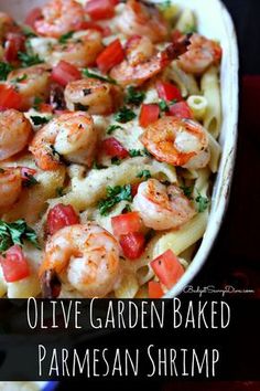 pasta with shrimp and tomatoes in a white bowl