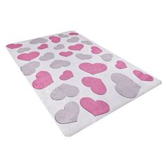 a pink and grey rug with hearts on the floor in front of a white background