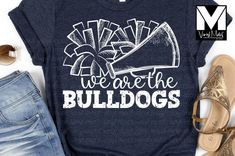 We are the Bulldogs-Cheer High quality BELLA+CANVAS short sleeve tee or Gildan long sleeve tee or sweatshirt with heat transfer vinyl design Unisex fit Professional application with laser alignment Color Shown: Navy When choosing shirt colors, please keep the following in mind: Lighter or white designs show up best on black, dark colors and bright colors. If you choose a very light color for your shirt, it will not show very well. Darker or black designs show up best on white, light colors and b Cheerleading Shirts Designs, Cute Cheer Shirts, Cheer Camp Shirts, Cheer Team Shirts, Cheer Coach Shirts, Spirit Wear Designs, Cheerleading Tshirts, School Spirit Shirts Designs, Youth Cheer