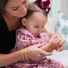 WILL ARRIVE IN TIME FOR CHRISTMAS! Baby’s first bracelet! Meet the Baby Marie Bracelet — a very special addition to our collection in honor of Christina’s daughter, Marie. Jewelry holds a special place in the timeline of a family, often passed from generation to generation. Perfect for family photos, baptisms, and other special moments in a newborn and infant’s life, this baby bracelet is a beautiful gift that will be cherished. Modeled after a baby bracelet passed down in Christina’s family, th Infant Jewelry, Combat Boots Heels, Baby Jewelry Gold, Felt Cowboy Hats, Concert Fashion, Baby Bracelet, Baby Jewelry, Boot Jewelry, Matching Bracelet