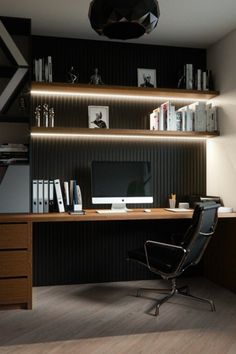 a desk with a computer and books on it in front of a window next to a potted plant