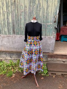 Bold geometric shapes in bright yellow, green and red cover this pleasingly crisp African wax print cotton. The cloth shows designs from the Ndebele people of South Africa. These wrap skirts fit all sizes from UK 8-20 ( waist 24" to at least 45").  A full 1950s look with the flexibility of a wrap. Deep pleats give a defined look and wide wrap around ties give a satisfying bow.  This one is approx 38" long hanging around ankle length. I have stitched a few size options on the waistband at 4" inte Cotton Wrap Skirt, 1950s Look, Red Cover, Wrap Skirts, African Wax Print, Skirt Fits, Wax Print, Green And Red, Classic Elegance