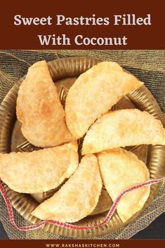 sweet pastries filled with coconut in a bowl on top of a burlly cloth