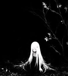 a woman with long white hair sitting in the grass next to a leafy tree