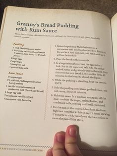 a person is holding an open book in their left hand and reading it with the title granny's bread pudding with rum sauce