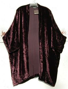 NNWT Eskandar DARK SHIRAZ Velvet 36" Long Duster Jacket Generous Size (0) $1595 COLOR:  DARK SHIRAZ (LOOKS LIKE A DARK PURPLE)   Shawl collar, open front, 3/4 sleeves with drop shoulder. Measurements All of the measurements are approximate and measured laying flat than doubled.    Since sizes do vary,   so please e-mail me before bidding if you are not sure about sizing.   Bust 62”, Hem 62”, Length 36” Material 82% Viscose, 18% Silk  Care Dry Clean Made in England by Eskandar     NO RETURNS, REF Velvet Shrug Long, Dark Bohemian Fashion, Dark Purple Outfit, Long Velvet Jacket, Velvet Duster, Purple Shawl, Velvet Cardigan, Unusual Clothes, Velvet Cloth