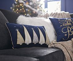 a black couch with christmas decorations on it