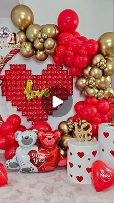 valentine's day decorations and balloons on display in a room