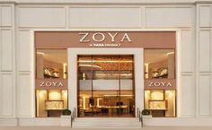 the entrance to a store that sells zoyaa and other luxury items in front of it