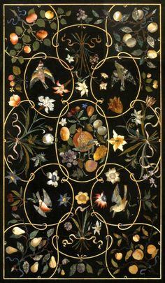 an intricately designed wall hanging with flowers and birds on black velvet, possibly from the late 19th century