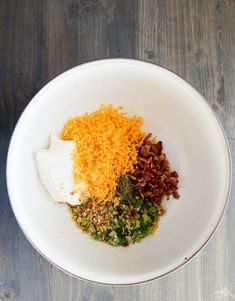 a white bowl filled with different types of food