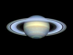 saturn with its rings in the dark sky