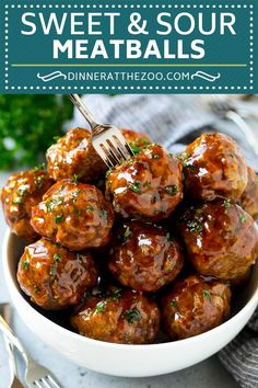 a white bowl filled with meatballs covered in sauce and garnished with parsley