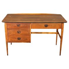 an old wooden desk with two drawers on one side and a drawer on the other